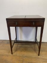 A 19th century mahogany enclosed dressing table, the folding top to reveal an adjustable mirror, and