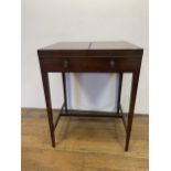 A 19th century mahogany enclosed dressing table, the folding top to reveal an adjustable mirror, and