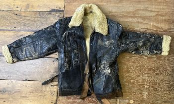 A sheepskin flying jacket, and assorted other military related items (box)