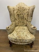 A Georgian style wingback armchair