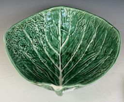 A Continental salad set, in the form of cabbage leaves, a painted pottery bowl, decorated fish,