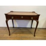 A Dutch mahogany table, having a raised rim, with a single frieze drawer on cabriole legs and pad