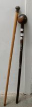 A silver mounted walking stick, and another (2)