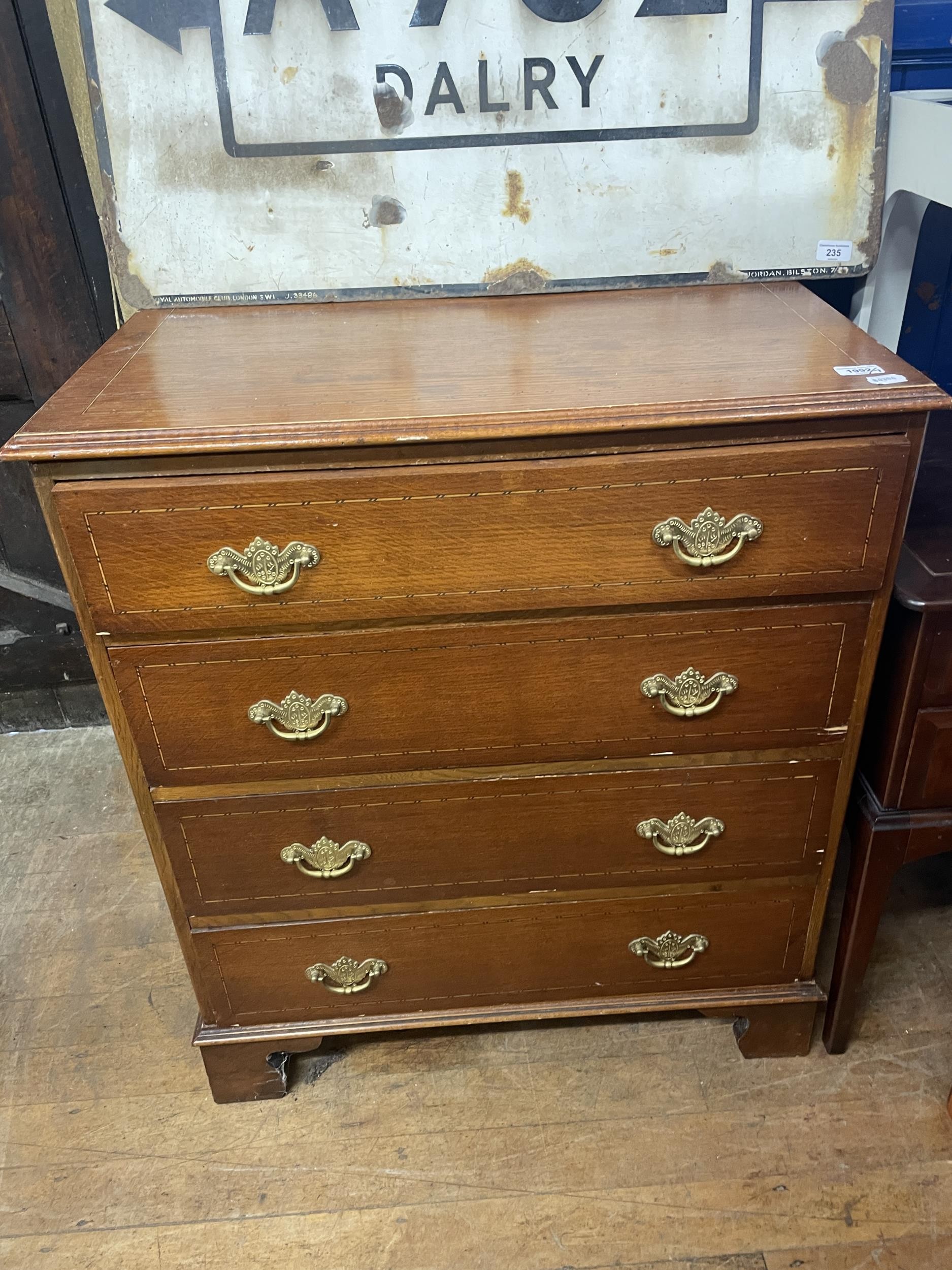 An oak chest, a dressing table, a drum table, a side table, a rocking chair, a single chair, and