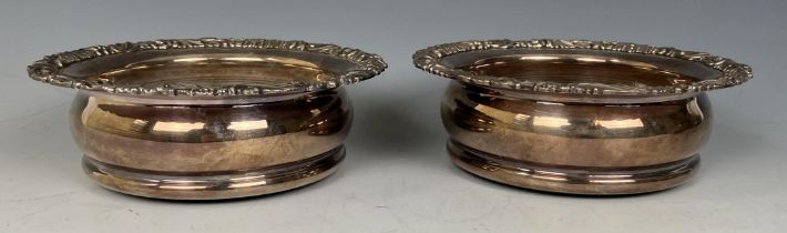 A pair of silver plated bottle coasters, two canteens of silver cutlery and other silver plate (box)