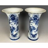 A pair of Delft blue and white vases, 23 cm high Rims repaired