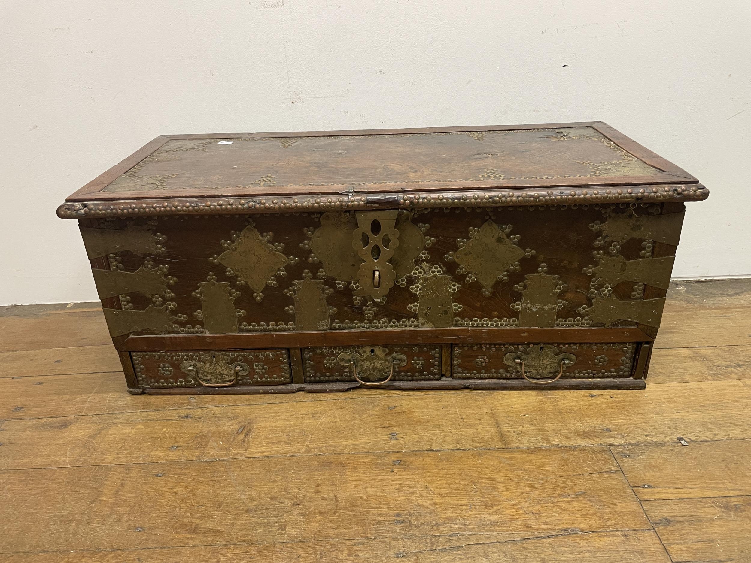 An Eastern mahogany and brass bound coffer, top loose, 106 cm