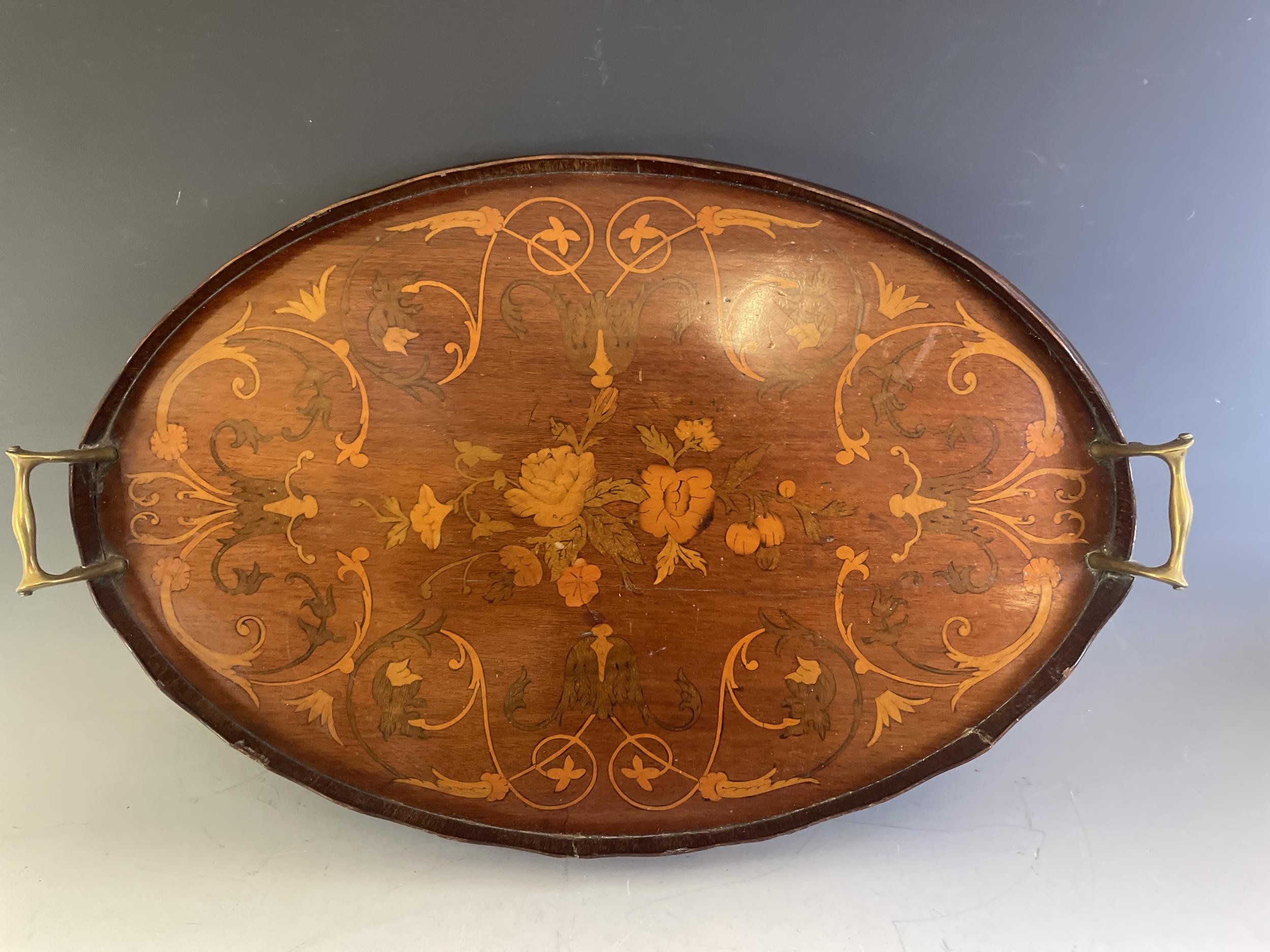 A mahogany marquetry inlay tray, 81 cm, and a footstool (2)