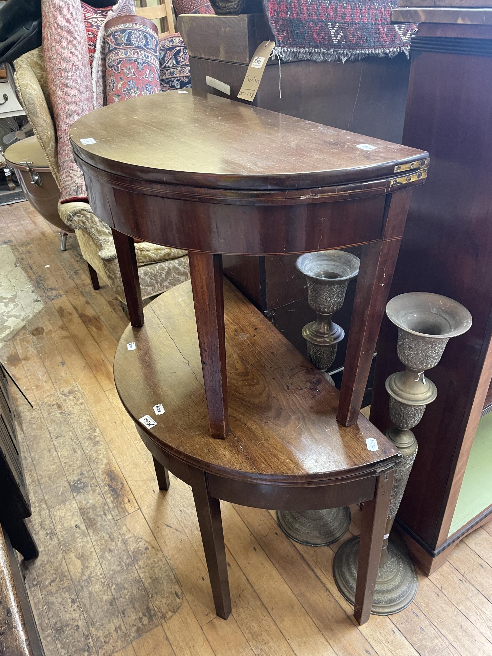 A mahogany demi-lune folding card table, 85 cm wide, another, both reduced (2)