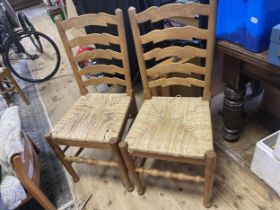 A set of six pine ladder back dining chairs, with reeded seats (6)