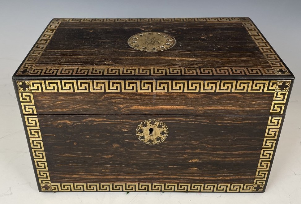 A 19th century coromandel and brass inlaid tea caddy, fitted two satinwood caddies, 26 cm wide