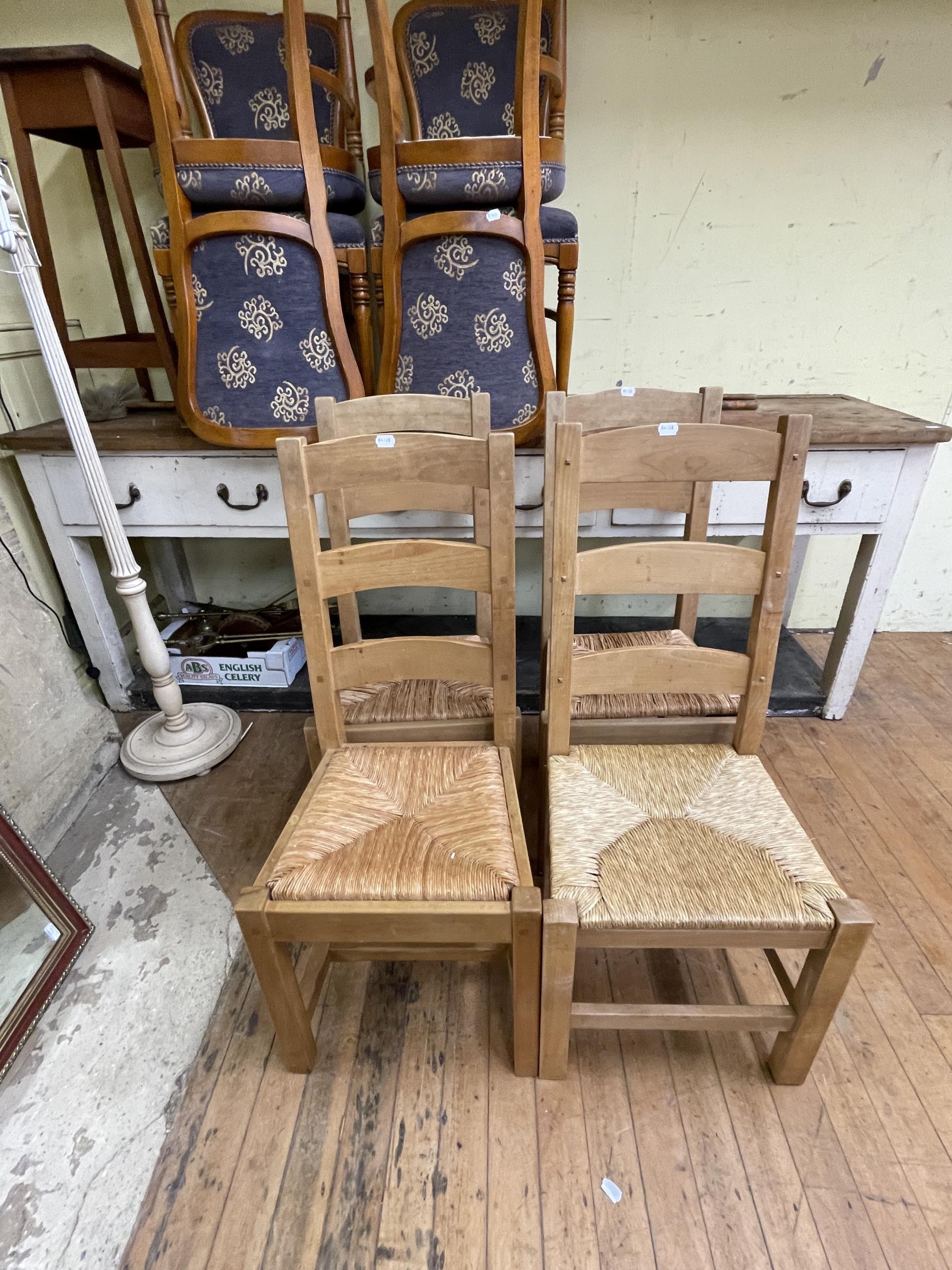 A modern light oak kitchen table, 153 x 92 cm, six pine ladder back dining chairs, a set of four - Image 7 of 10