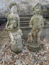 A pair of composite stone garden statues of a young boy and girl, 70 cm high