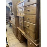 A pine chest, of two short and five long drawers, 92 cm wide, a dressing table, two pine chests