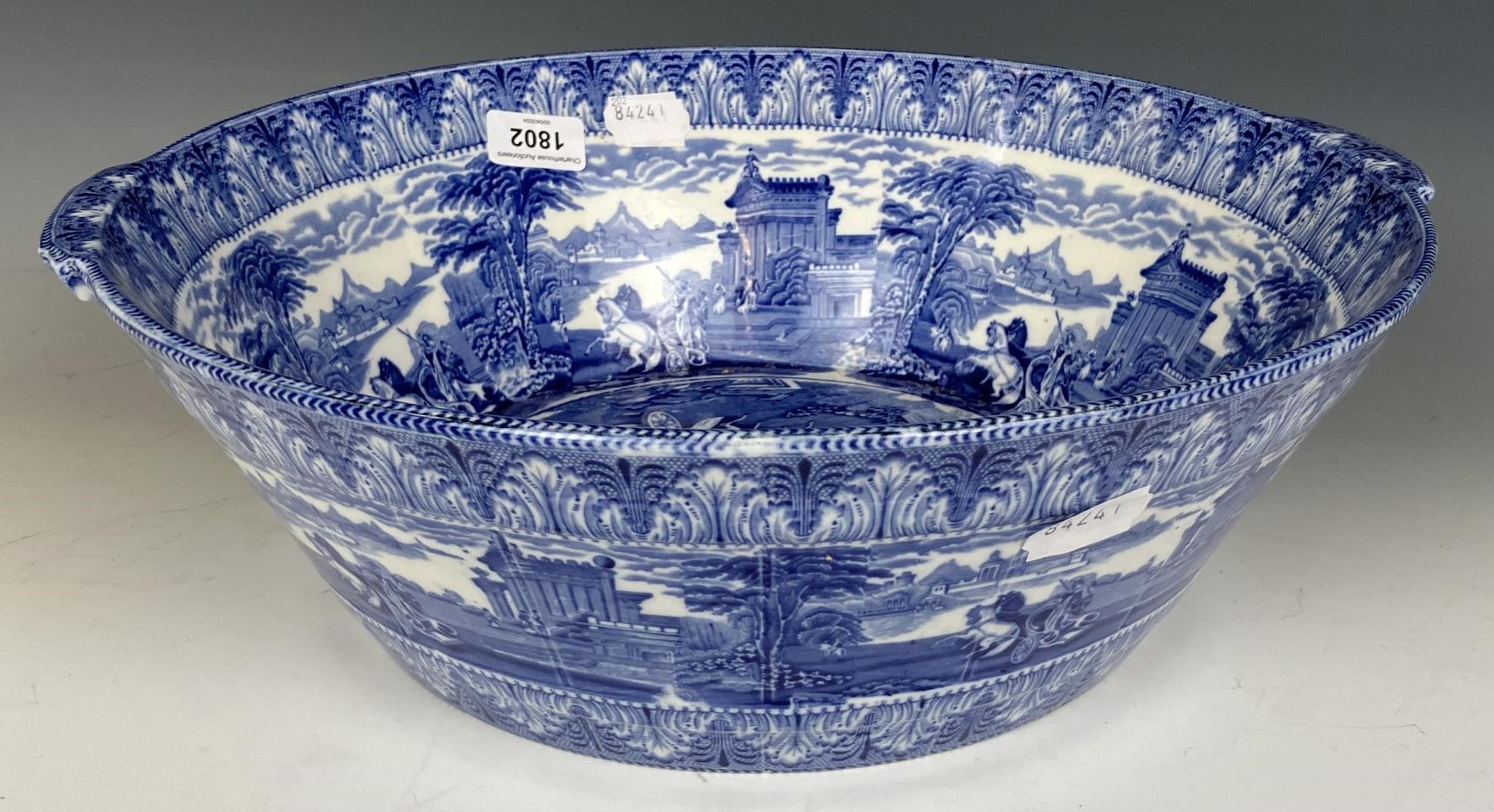 A late 19th century Cauldon blue and white basin or cream pan, decorated classical scenes, 40 cm