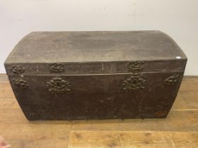 A leather studded trunk, with metal mounts, 125 cm wide Thought to be 18th century, heavy sign of