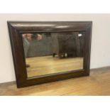 A mahogany cushion shaped wall mirror, 63 x 78 cm