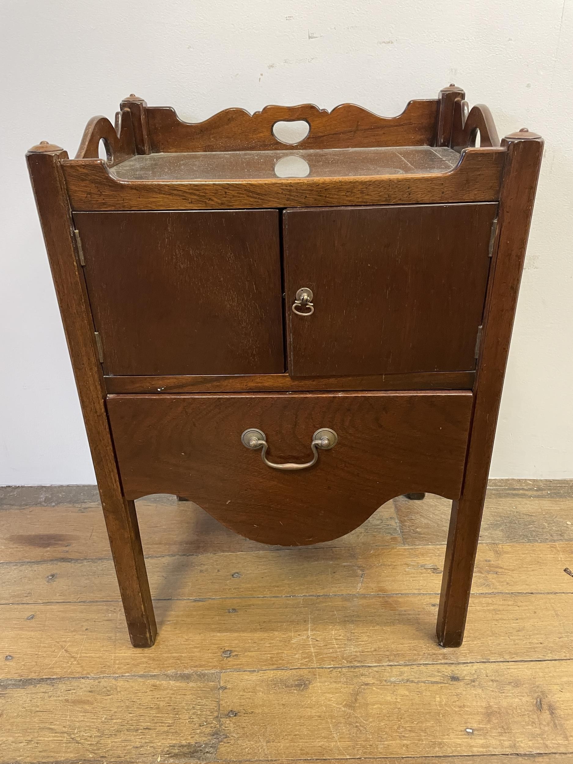 A mahogany tray top commode