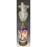 A Japanese Imari vase, converted to an oil lamp, with an acid etched glass shade, 46 cm high, and