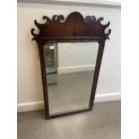 A mahogany fret framed mirror, 97 x 59 cm