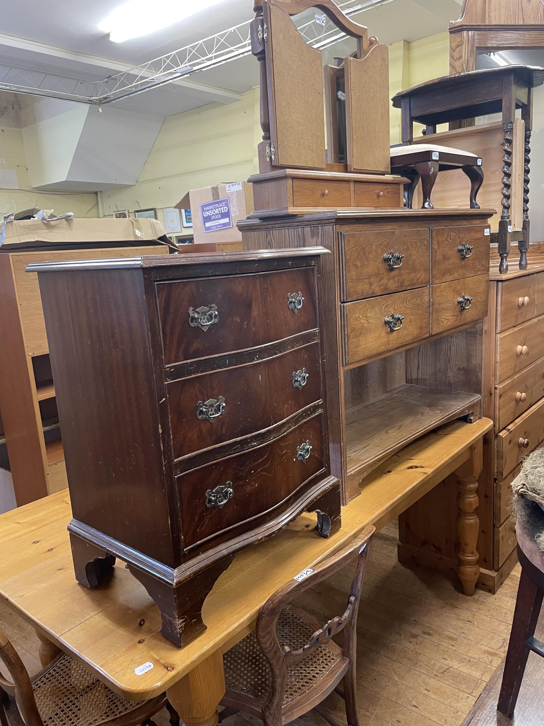 A pine kitchen table, 168 cm wide, a TV stand, a chest of three drawers, a side cabinet, a stool,