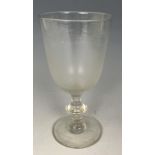 An 18th/19th century wine glass, four other glasses, a tyg, and two plates