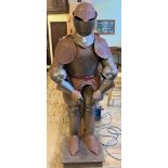 A 17th century style suit of armour, on a stand, 164 cm high some surface rust