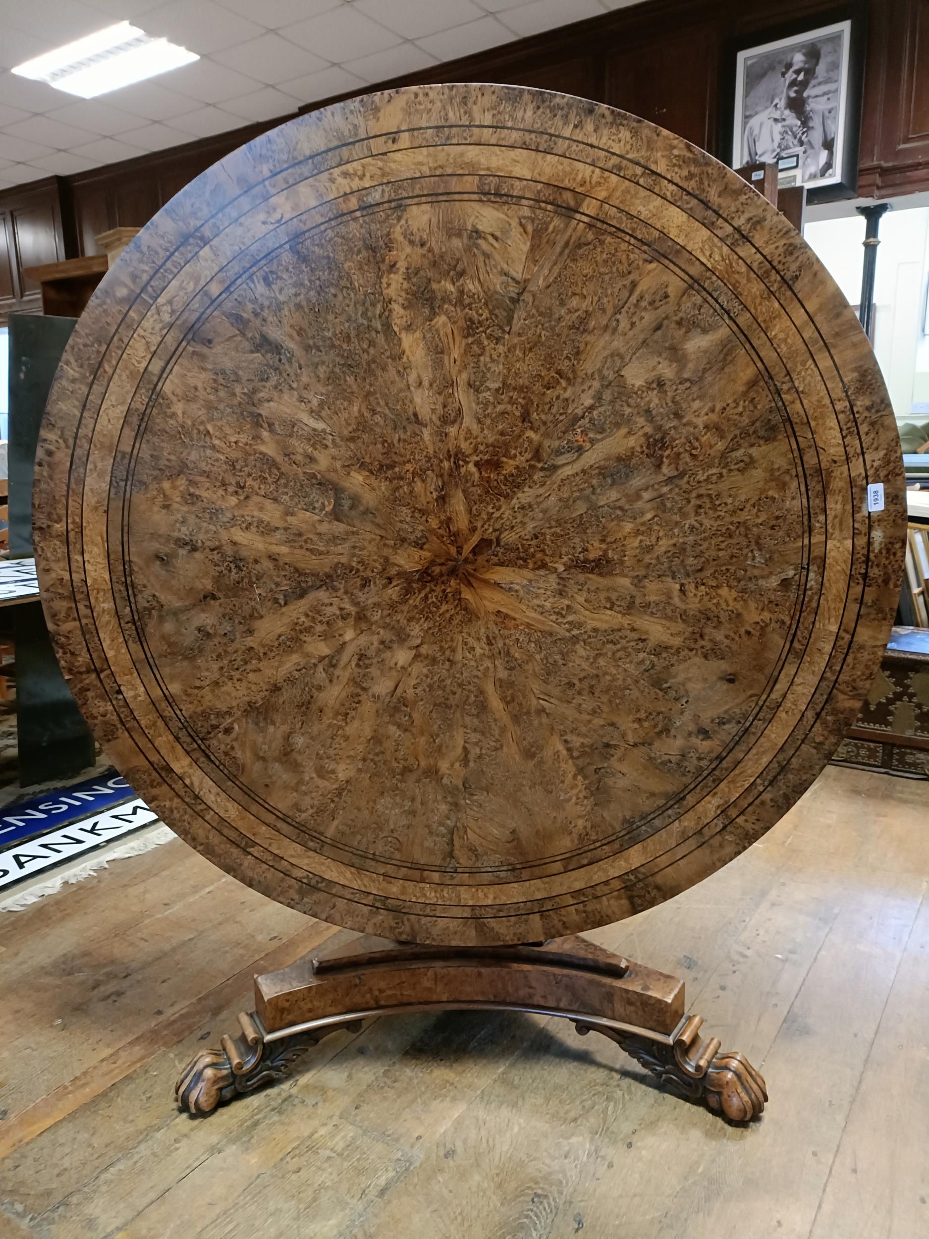 An early 19th century burr yew centre table, in the manner of George Bullock, the top with ebony