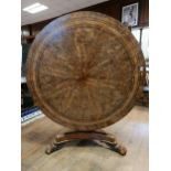 An early 19th century burr yew centre table, in the manner of George Bullock, the top with ebony