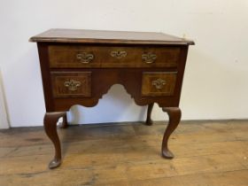 A walnut lowboy, with three drawers, 79 cm wide Various losses, in need of restoration