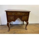 A walnut lowboy, with three drawers, 79 cm wide Various losses, in need of restoration