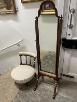 A cheval mirror, in a walnut frame, 158 cm high, and a nursing chair (2)