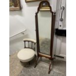 A cheval mirror, in a walnut frame, 158 cm high, and a nursing chair (2)