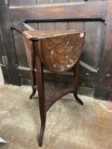 A carved walnut triangular table, with drop leaves, decorated leaves and pomegranates, 44 cm wide