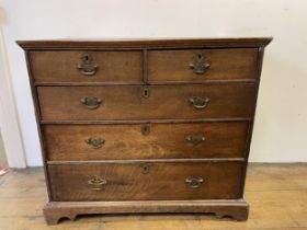 An oak chest, having two short and three long drawers, 96 cm wide