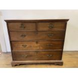 An oak chest, having two short and three long drawers, 96 cm wide