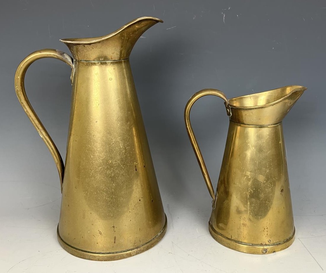 A graduated pair of brass jugs, a wicker basket and assorted other items (qty)