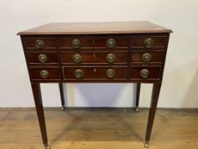 A 19th century mahogany enclosed dressing table, with a folding top revealing a fitted interior with