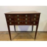 A 19th century mahogany enclosed dressing table, with a folding top revealing a fitted interior with