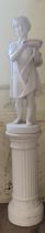 A plaster composition figure, of a young boy holding a bowl with outstretched arms, on a column