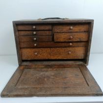 Assorted clock makers and other tools, in a cabinet 44 cm wide