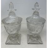 A pair of 18th century style cut glass vases and covers, 27 cm high damaged