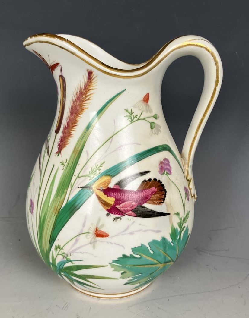 A 19th century Coalport jug, decorated birds, handle restored, a stand, and assorted other