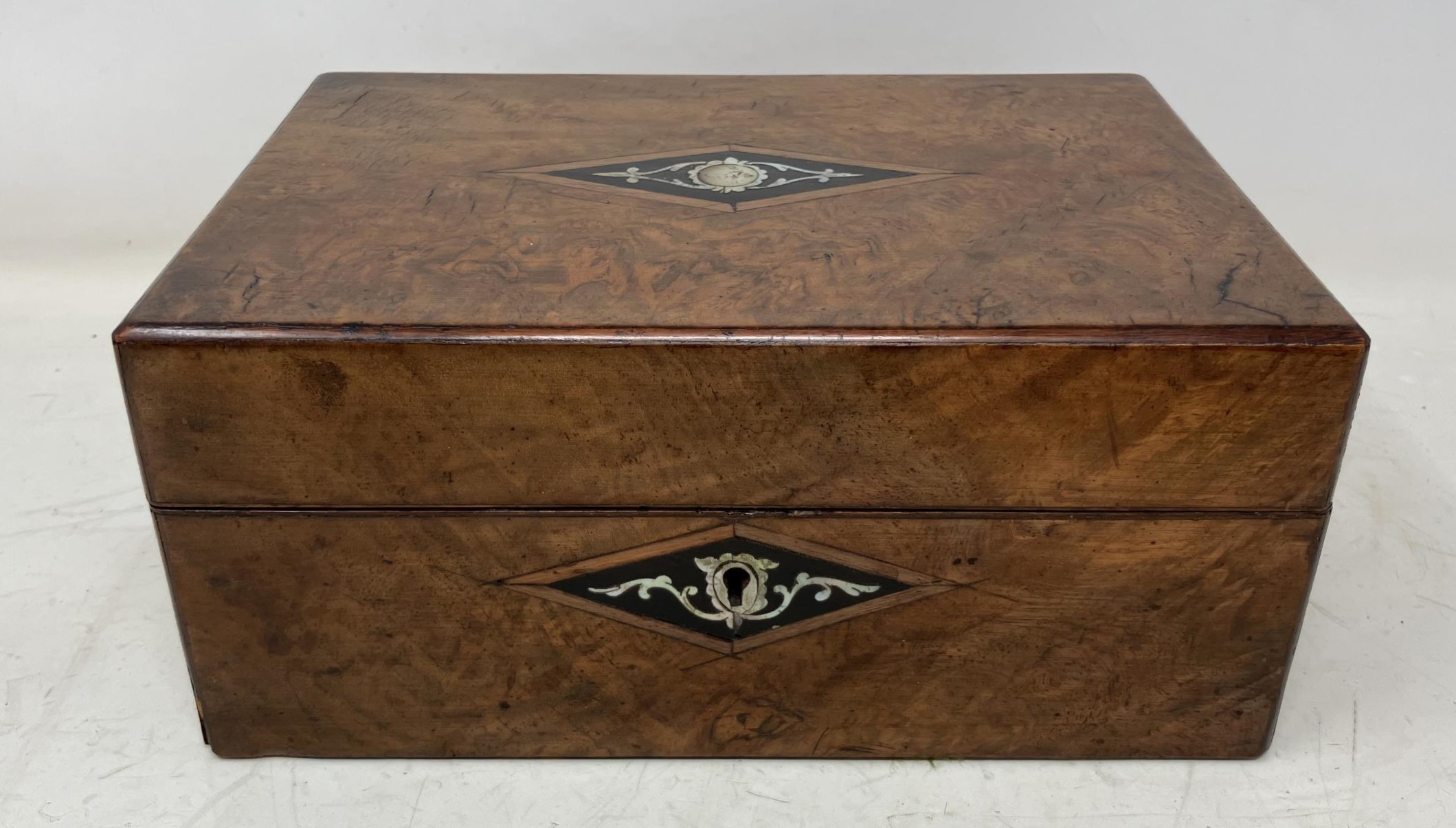 A Victorian walnut workbox, 25 cm wide