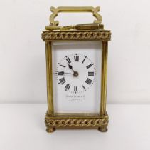 A carriage clock, retail by Favre Leuba & Co., in a brass case, 15 cm high