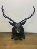 A cast iron hat stand in the form of a stag's head, 73 cm wide