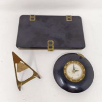 An American Art Deco bedside clock,a cigarette case, a Art deco glass clock, silver photo frame