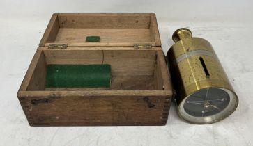 A brass hand held compass, 17 cm high, boxed, and four other compasses (5)