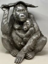 A silvered model of a orangutan, 48 cm high, and assorted blue and white balls (qty)