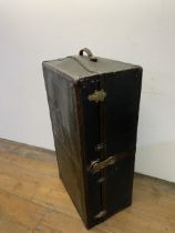 A vintage travelling trunk, 100 cm wide, and a suitcase